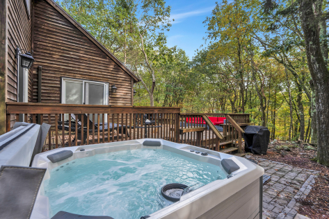 A hot tub on a deck AI-generated content may be incorrect., Picture