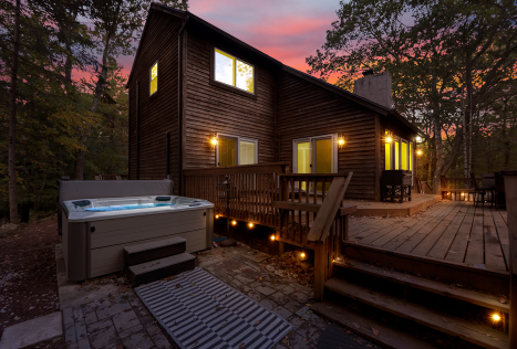 A house with a hot tub and a deck AI-generated content may be incorrect., Picture