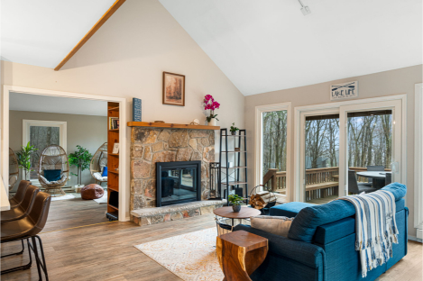 A living room with a fireplace and a couch AI-generated content may be incorrect., Picture