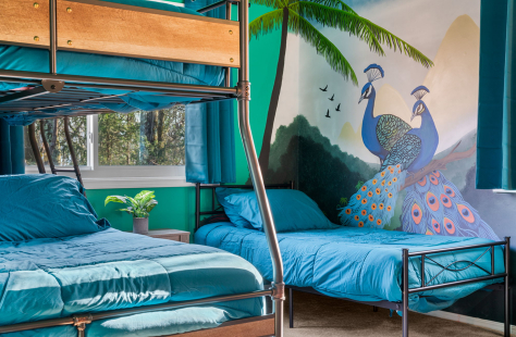A room with bunk beds and a mural on the wall AI-generated content may be incorrect., Picture